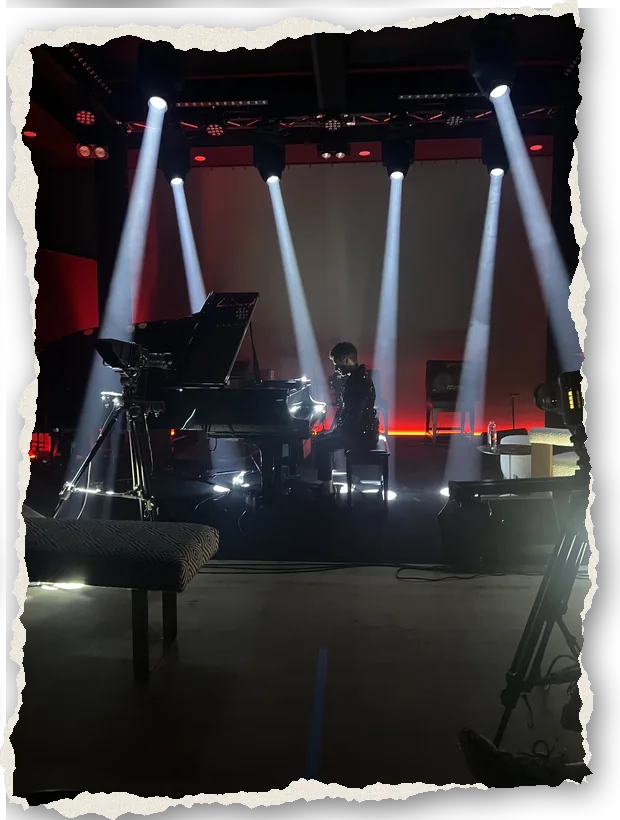 White light beams over the piano in The Recording Club's Live Room