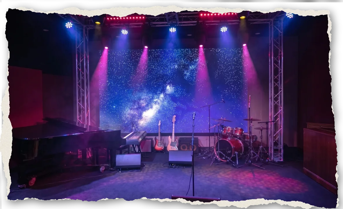 The Live Room at The Recording Club with its starfield LED wall, stage beams, piano, guitars and drums